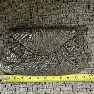 Elegant Lauren Merkin silver clutch bag